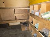 a small room with a lot of boxes on the floor