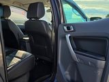 a car door open with the driver ' s seat down