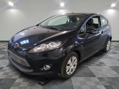 a picture of a black ford fiesta parked on a checkered floor