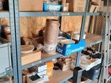 many shelves with various items on them in a room