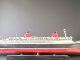 a model of a cruise ship on display on a table