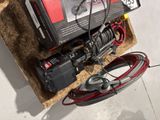 a box with wires and wires attached to it on the floor