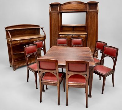 an image of a dining room set with red chairs and a wooden table