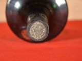 a close up of a bottle of wine on a table