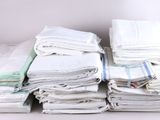 a stack of folded towels sitting on a table