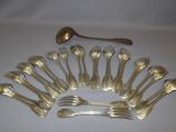 a lot of forks and spoons that are on the table
