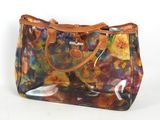 sac à main transparent à motif floral et anses en cuir, sur fond blanc
