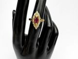 an image of a woman ' s hand with a ring on it