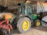 a tractor that is parked in a garage
