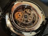 a close up of a watch on a table