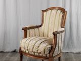 une image d'une chaise avec un siège rembourré à rayures
