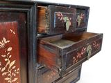 a wooden cabinet with two drawers and a drawer on top of it