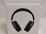 a box with a pair of black headphones on top of it