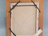 a picture of a picture frame with a piece of paper taped to it
