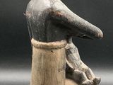 an image of a statue of a man sitting on a chair