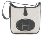 black and white bag with a smiley face on the front