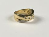 an image of a gold ring with diamonds on it