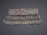 a close up of a bracelet with many different colored beads