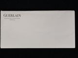 a close up of a white envelope on a black background
