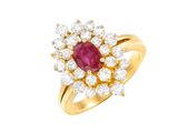 an oval ruby and diamond cluster ring