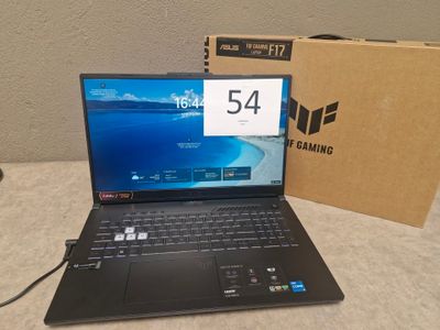 a laptop that is sitting on a table with a box
