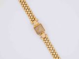 a gold bracelet with a square stone on it