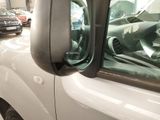 cars are parked in a parking lot with their doors open