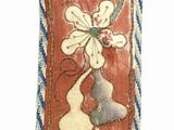 a picture of a red and blue ribbon with flowers on it
