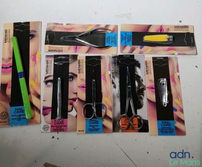 five different types of scissors and a pair of scissors on a table