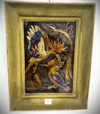 painting of a bird in flight in a gold frame on a white wall