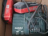 a box with a drill and a cord in it