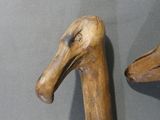 two wooden ducks that are on display on a table
