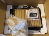 a cardboard box with a cage and some items inside of it