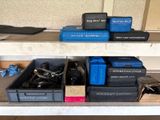 many boxes of tools on a shelf in a room