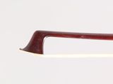 a close up of a violin bow on a white background