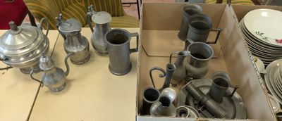 a box full of silver items on a table