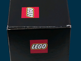 a black box with a red and white lego car inside of it