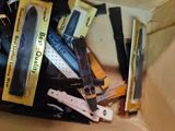a cardboard box filled with assorted watches and other items