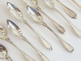 a lot of spoons that are sitting on a table