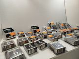 a lot of cassettes on a table in a room