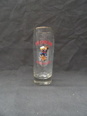 a shot glass with a mickey mouse design on it