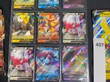 a lot of pokemon cards that are on the table