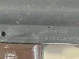 a close up of a gun that is on display