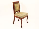 a wooden chair with a upholstered seat on it