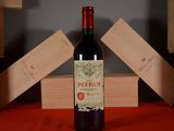 a bottle of wine that is sitting on a table