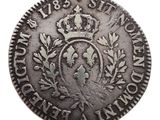 a close up of a coin with a crown on it