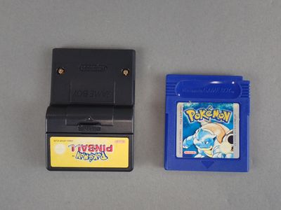 two nintendo games on the table next to each other