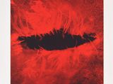 a red poster with a black hole in the middle of it
