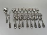 a lot of forks and spoons on the table
