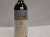 a bottle of wine that is sitting on a table
